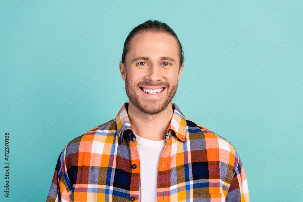 Portrait of good mood cheerful man with stubble wear flannel plaid jacket smiling at camera isolated on turquoise color background