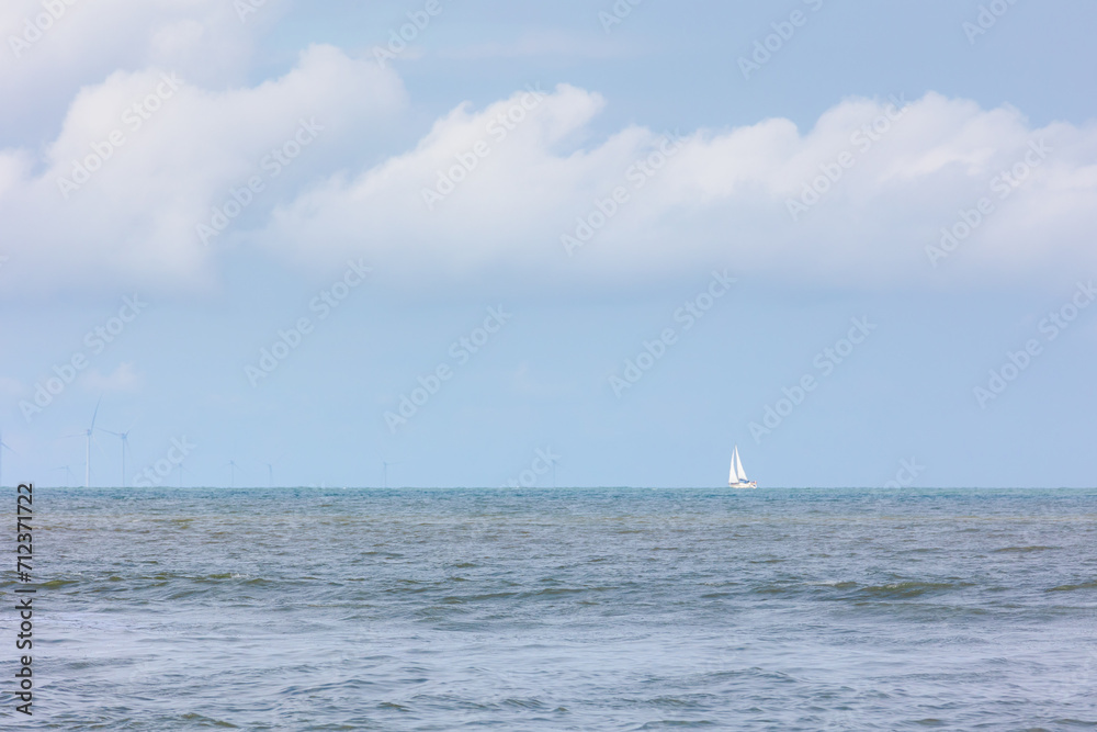 Summer landscape, Blue sea with blue sky and white cloud at Dutch north sea coastal, The North Sea part of the Atlantic Ocean between Britain, Belgium, the Netherlands, Germany, Scandinavia and France