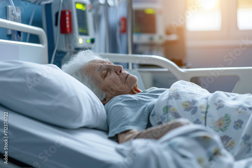 Male patient lying tiredly on hospital bed photo