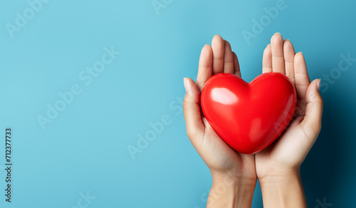 Photo of red heart in hands on a blue background. Mental health consept. Generative AI