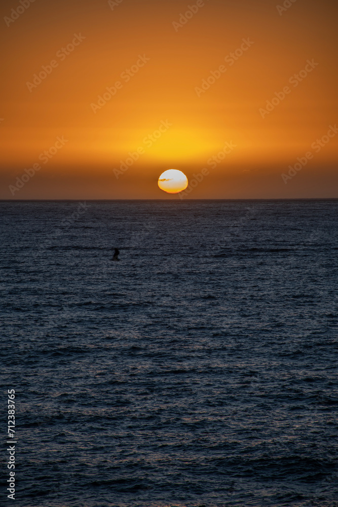 sun setting into the pacific ocean on the chile coast south america destination