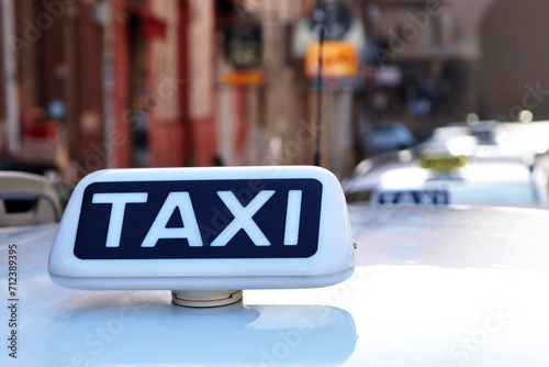 Italian white taxi sign, row of taxis