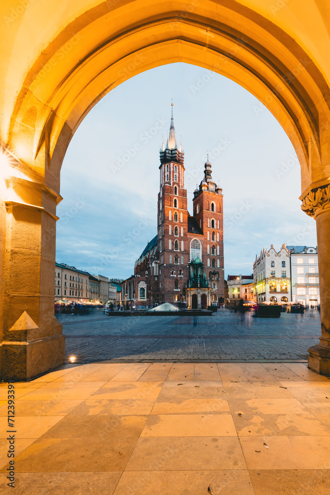 Cracow, Poland old town and St. Mary's Basilica seen from Cloth hall at the evening