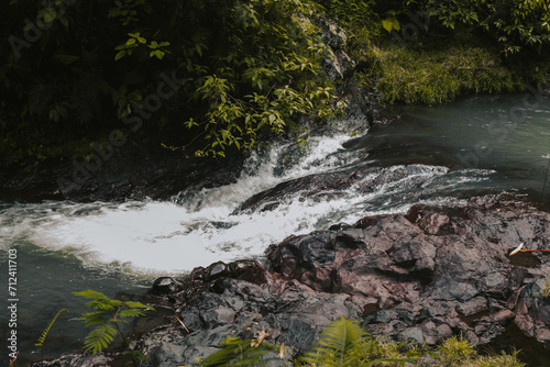 A bubbling clear mountain river in the rainforest. Beautiful natural background of nature