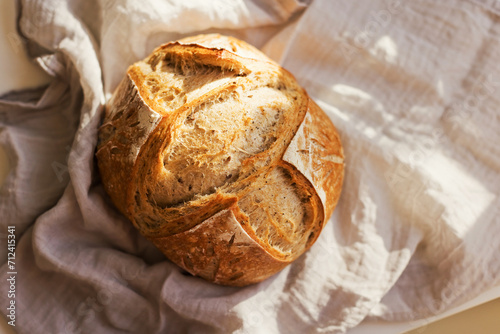 Freshly baked sourdough bread on table