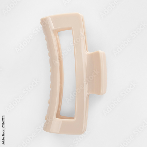 Woman hair accessories.  Hair claw clip isolated on white background. Trendy hairstyle. Trendy accessory. Fashionable accessory. Plastic claw clip.  