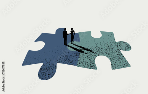 Business merger and acquisition, teamwork, business partner concept, businessmen handshaking on connected jigsaw puzzles.