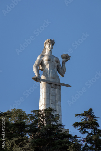 Mother Kartli  - Symbols of the city Tbilisi. The statue holds a cup of wine in one hand for friends and a sword in the other for enemies. Early morning. Summer day.
