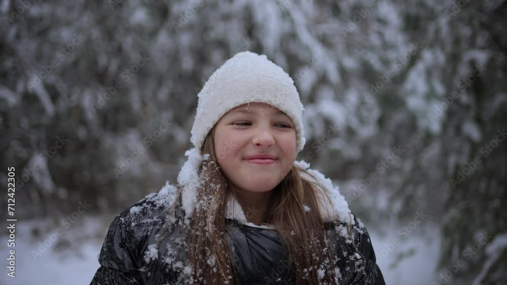 Close-up of a teenage girl having fun in a snowy forest. Winter vacation concept Close-up of a teenage girl having fun in a snowy forest. Winter vacation concept