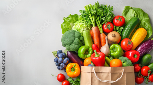 Delivery healthy food background. Healthy vegan vegetarian food in paper bag vegetables and fruits on white background  copy space  banner. Shopping food supermarket and clean vegan eating concept mix