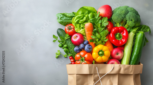 Delivery healthy food background. Healthy vegan vegetarian food in paper bag vegetables and fruits on white background  copy space  banner. Shopping food supermarket and clean vegan eating concept mix