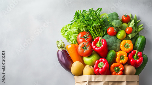 Delivery healthy food background. Healthy vegan vegetarian food in paper bag vegetables and fruits on white background, copy space, banner. Shopping food supermarket and clean vegan eating concept mix