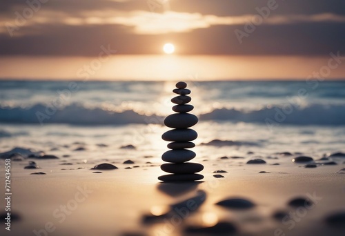 Balanced pebble pyramid silhouette on the beach with the ocean in the background Zen stones on the s