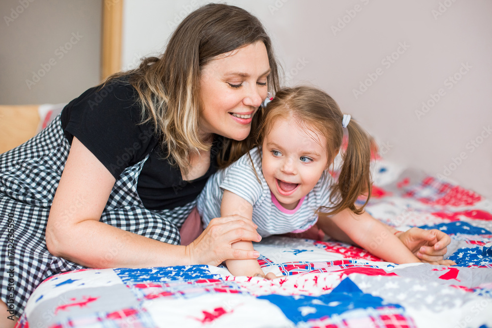 Grandmother and granddaughter playing together at home Grandmother and granddaughter playing together at home