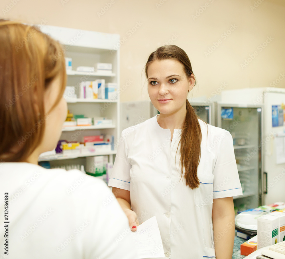 Pharmacist suggesting medical drug to buyer Pharmacist suggesting medical drug to buyer