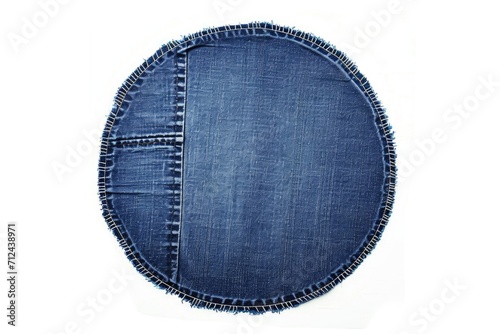 A denim circle with fray edges on a white background. Suitable for fashion, textile, or DIY projects