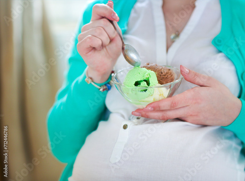 Pregnant woman with ice cream