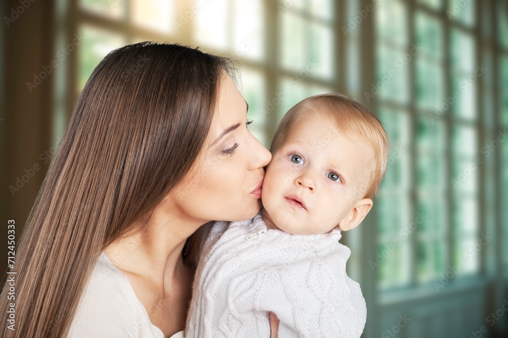 portrait of beautiful mother kissing her child portrait of beautiful mother kissing her child