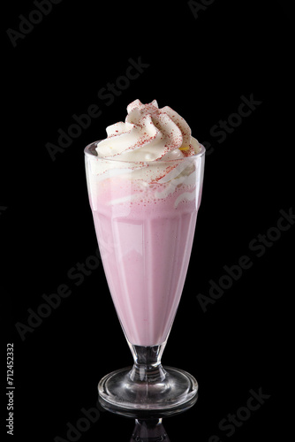 Raspberry milkshake. Black background. Dilicious cocktail.