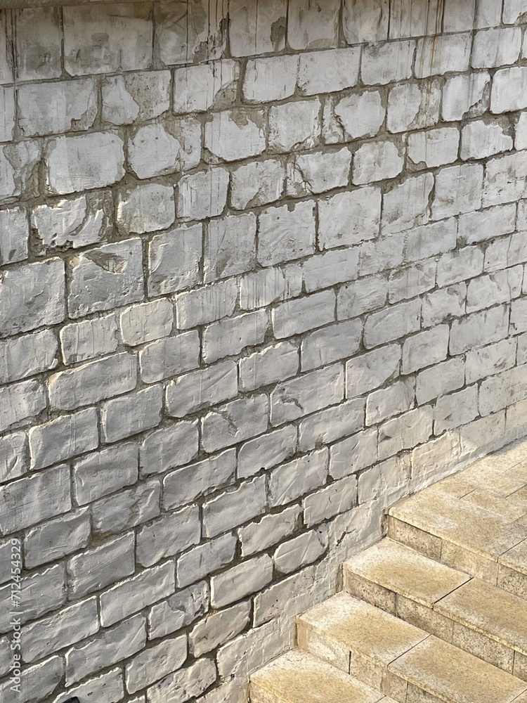 Stone staircase and wall with rough texture and bright sunlight. Classical architecture background. Empty, no people. Stone staircase and wall with rough texture and bright sunlight. Classical architecture background. Empty, no people.