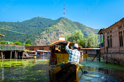 Dal Lake and the beautiful mountain range in the background, in the summer Boat Trip, of city Srinagar Kashmir India. photo