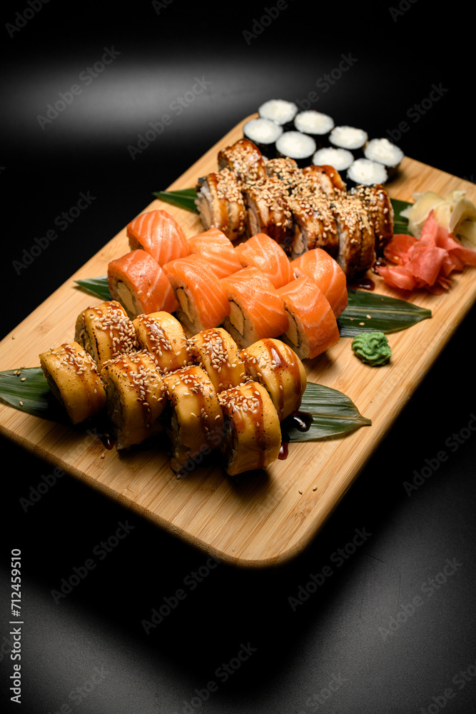 Top view of philadelphia sushi rolls with eel, salmon and tuna and maki with cream cheese Top view of philadelphia sushi rolls with eel, salmon and tuna and maki with cream cheese