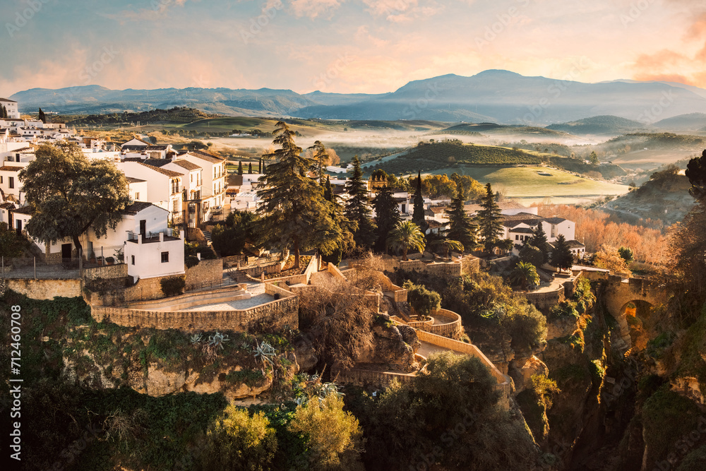 Jardines de Cuenca (Cuenca Gardens) and the Old Bridge, Ronda, Andalusia, Spain. They are terraced gardens hanging above the El Tajo gorge and are full of flowers during spring and summer.