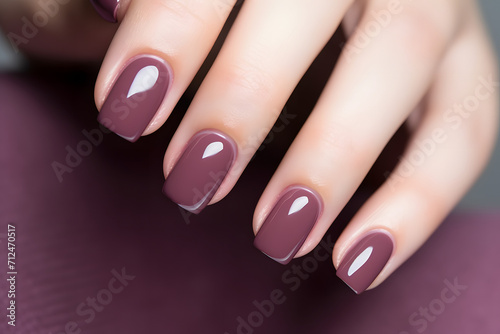 Glamour woman hand with deep berry and plum nail polish on fingernails Fototapeta