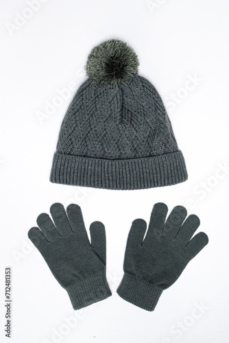 Warm knitted hat and gloves mittens for children on white background isolate on white background