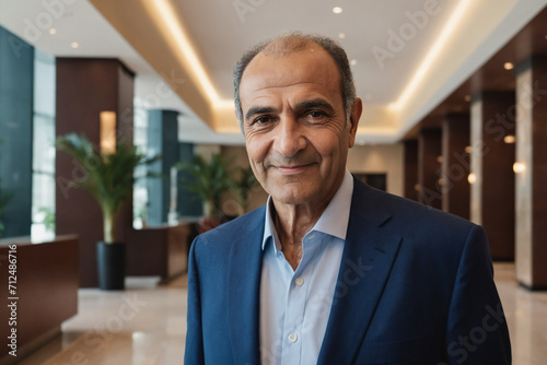 portrait of old age middle eastern businessman in modern hotel lobby