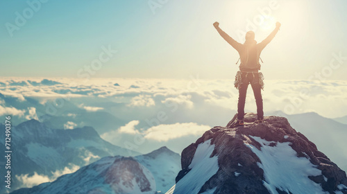 A hiker stands victorious on the summit of a mountain, arms raised in triumph against the backdrop of a breathtaking sunrise.