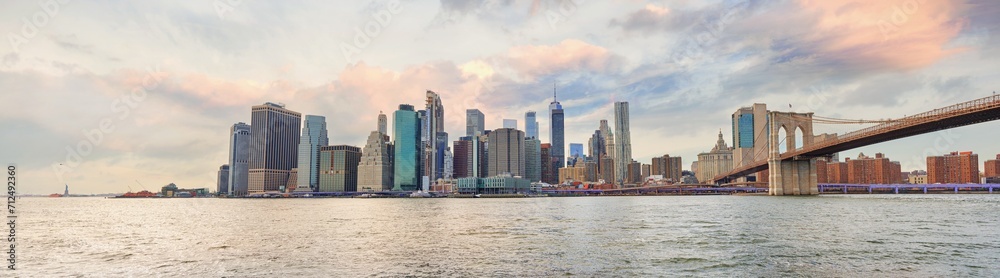 Panorama view of New York city and Brooklyn bridge at sunset. Panorama view of New York city and Brooklyn bridge at sunset.