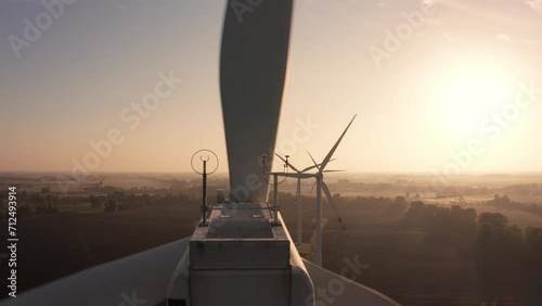 Aerial view Wind turbines in a farm field up close beautiful sunrise