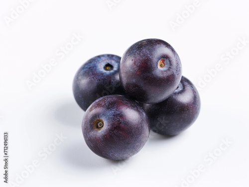 Fresh acai berries isolated on white background in a minimalist style.
