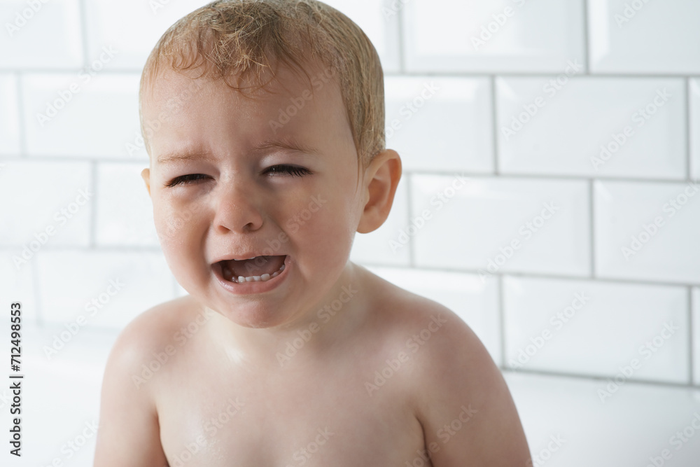 Sad, crying and baby boy at home, unhappy and distress and naughty childhood personality. Problem, emotional and frustrated young kid, bathroom and toddler with development, wet and vulnerable Sad, crying and baby boy at home, unhappy and distress and naughty childhood personality. Problem, emotional and frustrated young kid, bathroom and toddler with development, wet and vulnerable