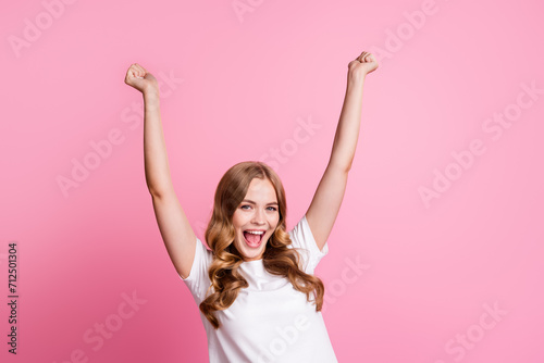 Portrait of lady win celebrate her new beauty product win in competition for best quality raised fists up isolated on pink color background photo