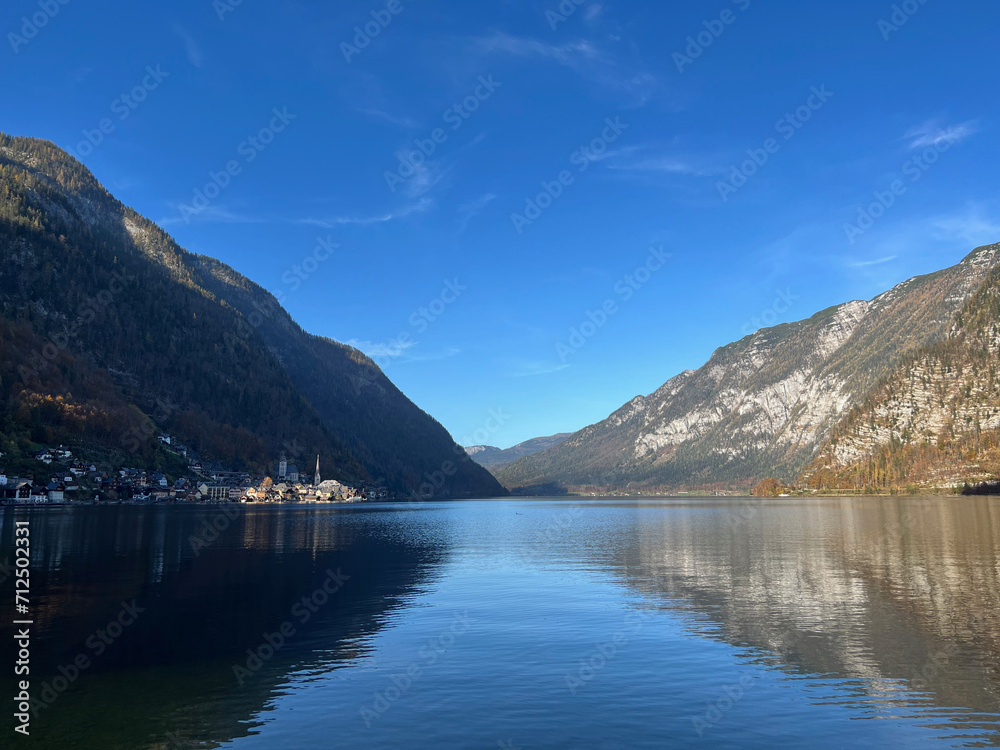 The famous village of Hallstatt across the lake, viewed from the Hallstatt Skywalk island, Hallstatt, Austria.