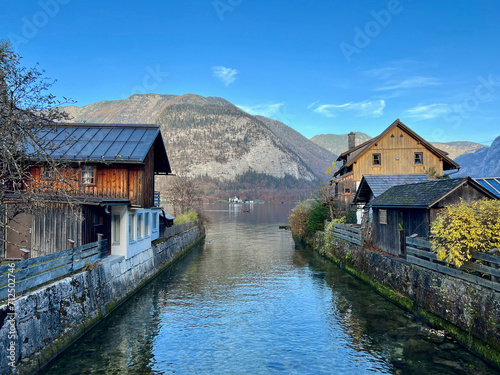 The small canal in Hallstatt village leading to the lake, passing by numerous houses.