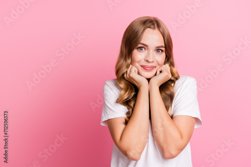 Portrait photo of young gorgeous stunning lady excited touch cheeks admiring daydreaming looking at you isolated on pink color background