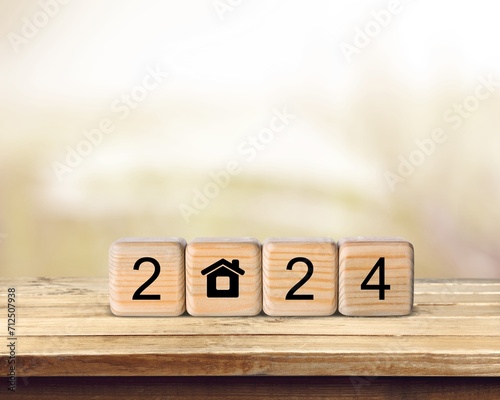 Happy 2024 New Year with Home icon on wooden cubes