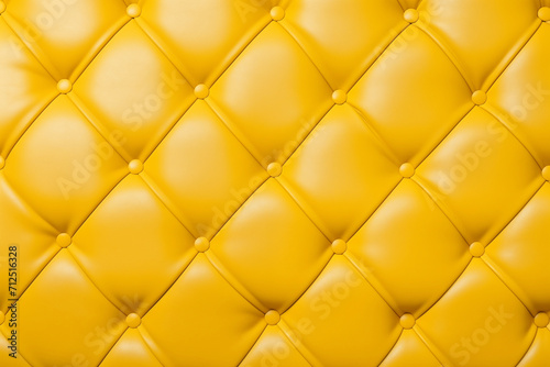Yellow leather capitone background texture 