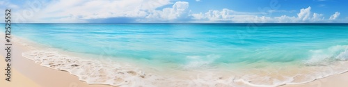 A panoramic view of a secluded beach with white sand and clear blue waters