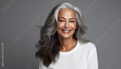Elegant Senior Lady: Portrait of a Happy, Confident, and Stylish Mature Woman with Grey Hair - Banner of Ageless Beauty, Modern Lifestyle, and Positive Contentment in a Studio Setting © BrightSpace