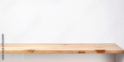 White background isolates empty wooden table/counter for product display.