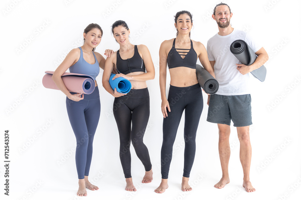 Group of happy sporty women and guy wearing body stylish sportswear holding personal carpets leaned on a white background. waiting for yoga class or body weight class. healthy lifestyle and wellness Group of happy sporty women and guy wearing body stylish sportswear holding personal carpets leaned on a white background. waiting for yoga class or body weight class. healthy lifestyle and wellness