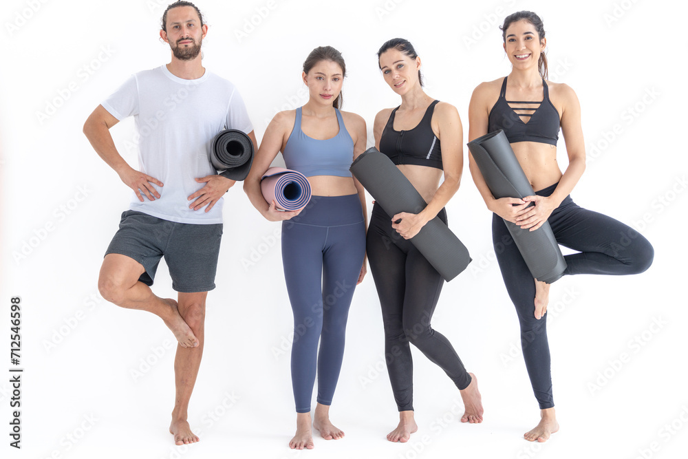 Group of happy sporty women and guy wearing body stylish sportswear holding personal carpets leaned on a white background. waiting for yoga class or body weight class. healthy lifestyle and wellness Group of happy sporty women and guy wearing body stylish sportswear holding personal carpets leaned on a white background. waiting for yoga class or body weight class. healthy lifestyle and wellness