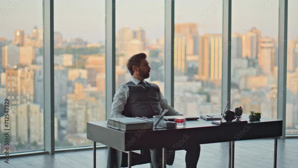 Thoughtful boss resting chair contemplating city sunset. Successful serious man Thoughtful boss resting chair contemplating city sunset. Successful serious man
