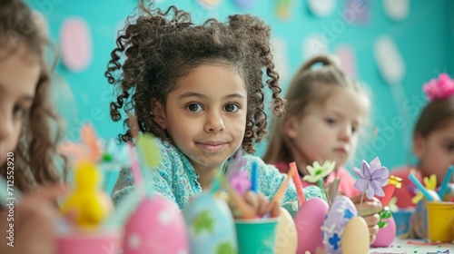 Children enjoying an Easter egg painting activity, using brushes and vibrant paints to create beautifully decorated egg
