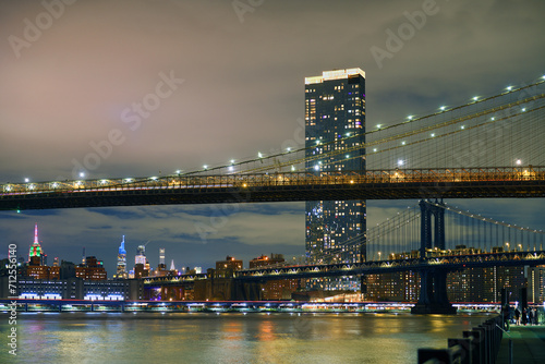 Brooklyn Bridge and Manhattan Bridge at night in winter  suspension bridges that crosses East River in New York City  United States