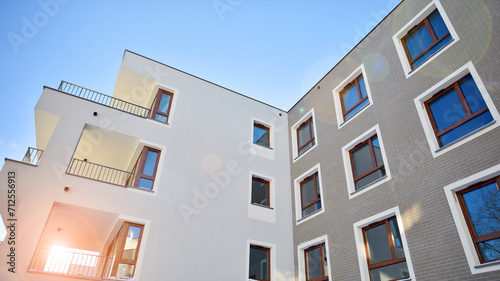 Modern apartment building in sunny day. Exterior  residential house facade. Residential area with modern  new and stylish living block of flats. 